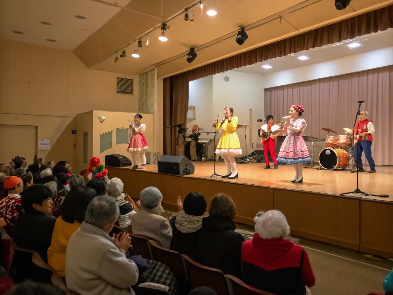 A captivating scene from a live performance organized by FCOL, showcasing artists and audience members enjoying a cultural experience.